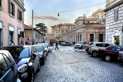 a street with cars parked on the side of the road at Vanella Rome Domus in Rome