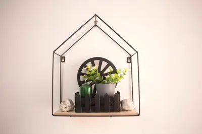 a shelf with a wheel and flowers and rocks at Roma Imperial Suites in Rome