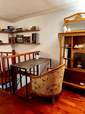 a dining room with a table and a chair at Colosseum Luxury Apartment in Rome