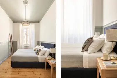 a bedroom with a bed and a table with a lamp at Elegante Dimora a Trastevere in Rome