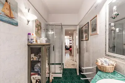 a bathroom with a walk in shower and a glass door at Appartamento Roma Centro in Rome