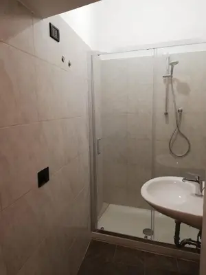 a bathroom with a shower and a sink at Lucky Domus Ottaviano in Rome
