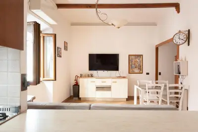 a living room with a couch and a tv at Elegant & Quiet Apartment next to Colosseo in Rome