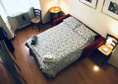 a bedroom with a bed in a room at A Place in Prati in Rome