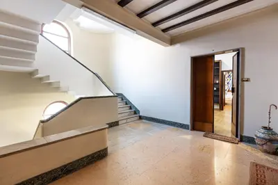 an empty hallway with stairs and a door at Passeggiata al Vaticano in Rome