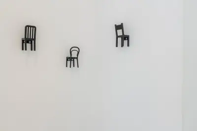 a group of black chairs sitting on a table at Contessa Elegance Inn in Rome