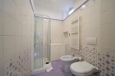 a bathroom with a toilet and a shower and a sink at Elisa's Trevi Fountain BuddyRent in Rome