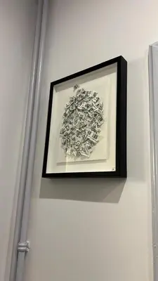 a picture on a white wall with a framed picture at Lovely art&design 2 bdrms flat in Rome