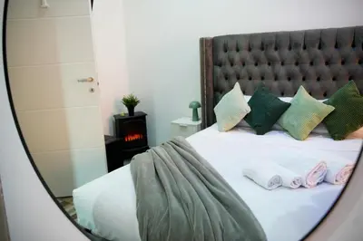 a collage of two pictures of a bedroom with a bed at Matriosca Suites in Rome