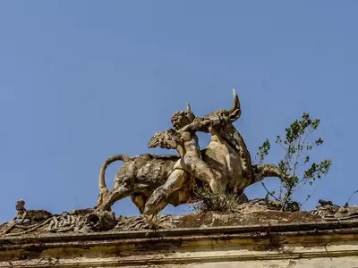 a statue of a man riding a horse on top of a building at Casa MastroiannI con Terrazzo in Rome