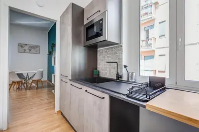 a kitchen with a sink and a counter top at Salotto San Pietro in Rome