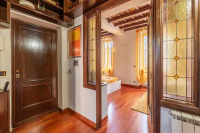 an empty hallway with a door and a room with at GuestHost - Trastevere Leopard'Oro Apartment in Rome