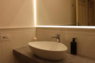a bathroom with a large white bowl sink on a counter at Irene's Home The Retreat in Rome