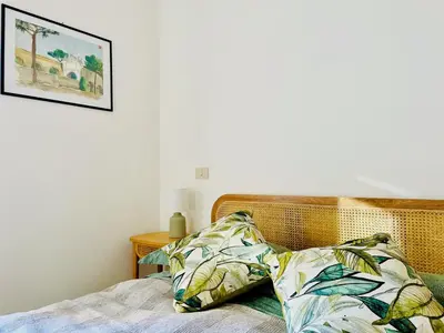 a bed with two pillows on top of it at GuestHost - The Design Pasta Apartment in Rome