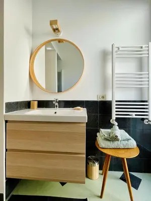 a bathroom with a sink and a mirror at GuestHost - The Design Pasta Apartment in Rome