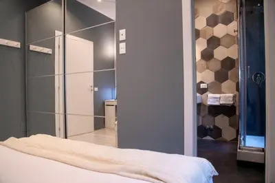 a bedroom with a mirror and a bed at Arezzo 38 in Rome