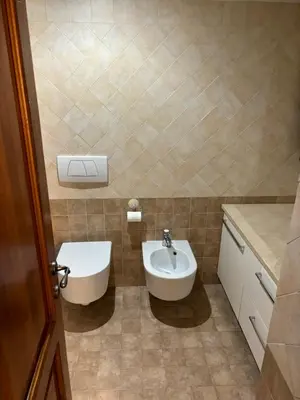 a small bathroom with a sink and a toilet at Boutique rooms trastevere in Rome