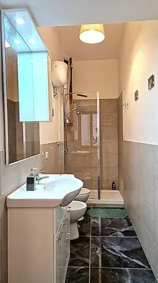 a bathroom with a sink and a toilet and a shower at MusicArt House in Rome