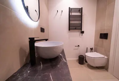 a bathroom with a large tub and a toilet at Scipioni Luxury Suite (3 camere, 3 bagni) in Rome