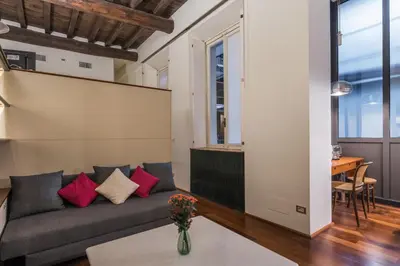 a living room with a couch and a table at iFlat Pantheon 's Gem in Rome