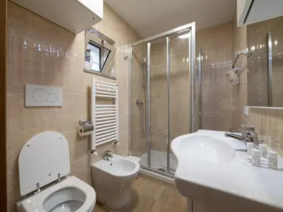 a bathroom with a toilet and a sink and a shower at Minerva House Pantheon in Rome
