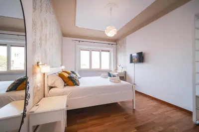 a small bedroom with a bed and a desk at St. Peter Twilight BuddyRent in Rome