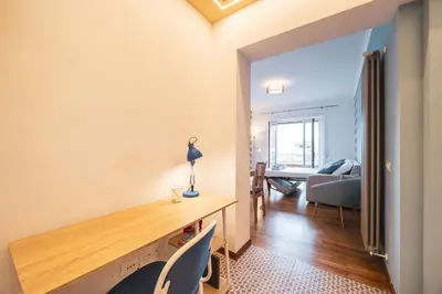 a living room with a wooden table and chairs at St. Peter Twilight BuddyRent in Rome