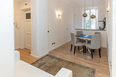 a dining room with a table and chairs at Giò House - Palazzo Storico in Rome