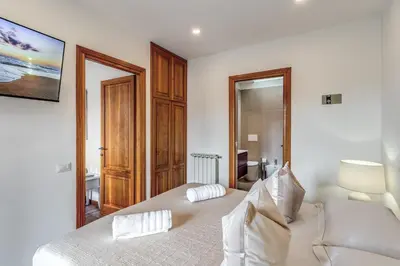 a bedroom with a bed with two pillows on it at Twilight Terrace - Piazza di Spagna in Rome