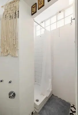 a bathroom with a shower with a shower curtain at Romeo. Luminoso appartamento al centro di Roma in Rome