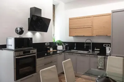 a kitchen with a microwave and a stove top oven at Casa Matteo53, Termini in Rome