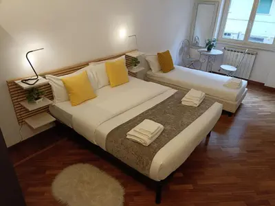 a living room with two beds and a couch at Pop Corn Vatican Suites in Rome