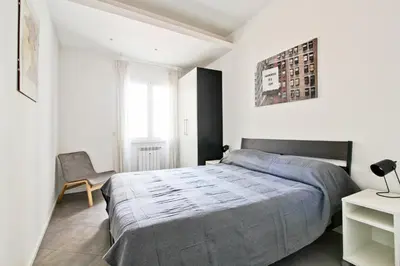 a bedroom with a bed and a chair in it at [Roma centro Storico * * * * *]- Via Torino Suite in Rome
