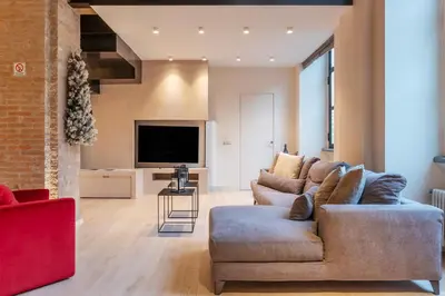 a living room with a couch and a tv at Luxury Loft next to Via Veneto in Rome