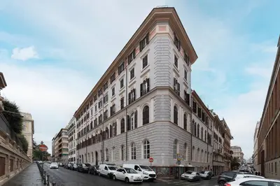 a large building with cars parked in front of it at Luxury Loft next to Via Veneto in Rome