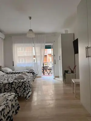 a bedroom with a bed with two towels on it at Dolce Vita Rooms Monteverde Trastevere in Rome