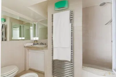 a bathroom with a toilet and a sink and a shower at Casa Adriana, a Burghesius home in Rome