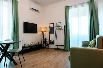 a living room with a couch and a table at Re di Roma apartment in Rome