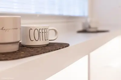 a coffee cup sitting on top of a counter at Trevi Steps in Rome