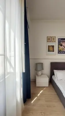 a bedroom with a bed and a table and a window at Galleria del Principe in Rome