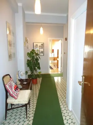 a hallway with a green floor in a house at B&B Rome Downtown Deluxe in Rome