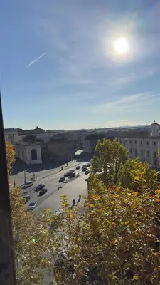 a view of a parking lot with cars parked at Maison Merulana Colosseo in Rome
