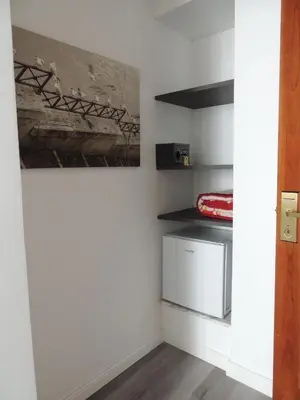 a kitchen with a washer and dryer in a room at Madonna della Neve in Rome