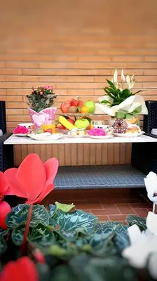 a table with fruits and vegetables on it at ROMA BeMa Apartment - charme e relax a due passi dal Vaticano in Rome