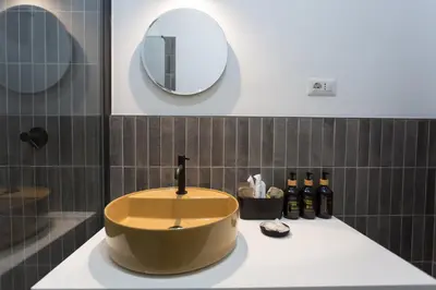a bathroom with a large bowl sink on a counter at Navona 68 in Rome