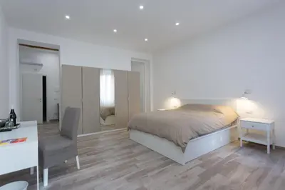 a bedroom with a bed and a desk and a chair at Navona 68 in Rome