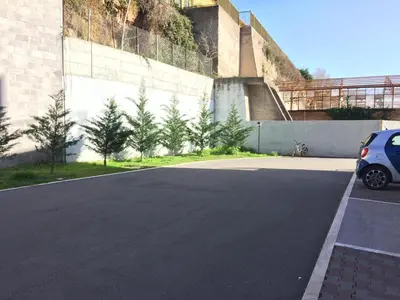 a car parked in a parking lot next to a building at 8380 Lory's House in Rome