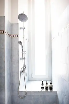 a shower in a bathroom with a window at Il Viandante al Pigneto - Parcheggio privato su richiesta in Rome