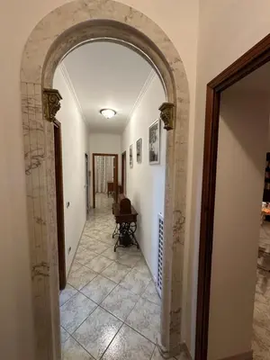 a hallway with an archway in a house at Ginny's Home in Rome