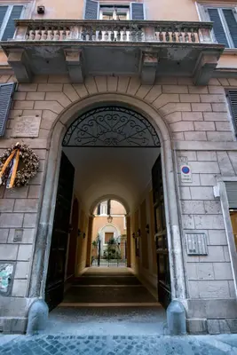 an entrance to a building with an archway at Assunta Domus in Rome